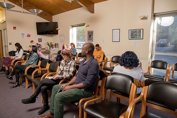 Models posing as patients sit in the Feminist Women’s Health Center waiting room.
